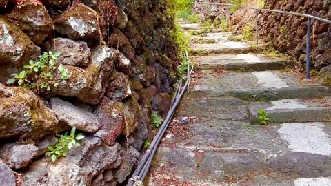 Walking along the old mountain staircase. Stone walls. Italy. Stock Footage 310301082