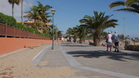 Walking along the Paseo Marítimo at La Guirra beach Stock Footage 269239380
