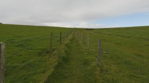 Walking along a path in the Orkney Islands Stock Footage 322074444