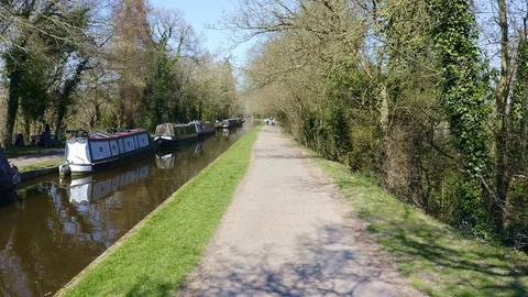 Walking along the path by the Pontcysyllte Aqueduct and Llangollen Canal Stock Footage 105856519