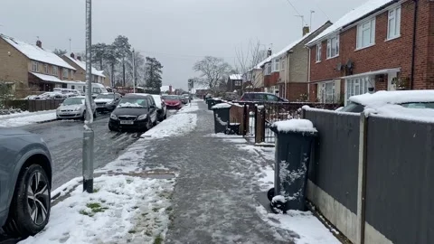 Walking along a pavement in snow Stock Footage 235152398