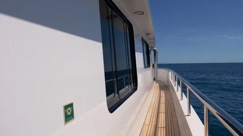 Walking along the promenade deck of a mega yacht  Stock Footage 111653485