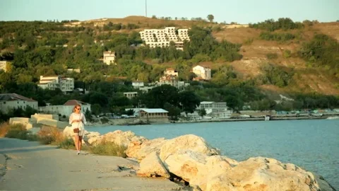 Walking along the promenade at sunset Stock Footage 69080745
