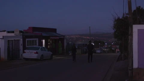 Walking along the road in the dark Stock Footage 242010942