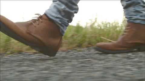 Walking along road Stock Footage 49650708