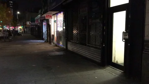 Walking along the sidewalk at night Stock Footage 120309060