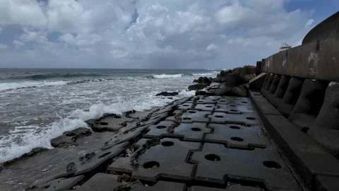 Walking Along Slippery Tetrapods on Rough Sea Coast in Okinawa, Japan Stock Footage 325653473