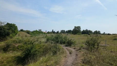 Walking along the top of a ridge, at Barnack Hills and Holes NNR Stock Footage 340284164
