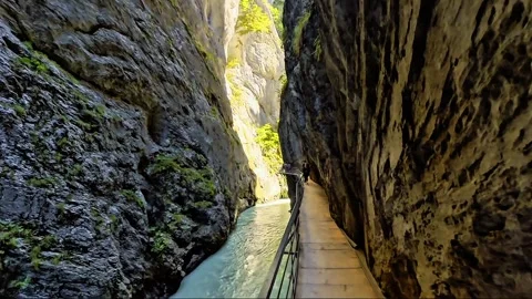 Walking Along Turquoise River Through Narrow Rocky Gorge Stock Footage 344878270