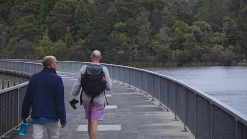 Walking along Waitakere Dam in the Waitakere ranges, Auckland, New Zealand Stock-Footage 287196650