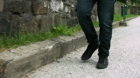 Walking alongside a curb Stock Footage 51721901