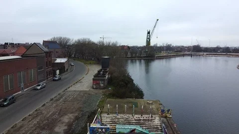 Walking among graffiti in abandoned factory on the sideways of a canal Stock-Footage 122232553