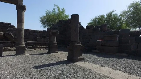 Walking Among Pillars of Old Synagogue Ruins in Israel Stock Footage 77698834