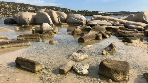 Walking among the rocks with marine transparency, scenic Stock Footage 129841292