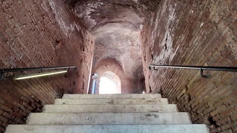 Walking up ancient Roman stone steps in a narrow historic street in Rome Italy Stock Footage 338184017