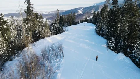 Walking up and down the hill in mountains at ski resort. Stockbeeldmateriaal 148723123