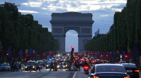 Walking and driving on Champs-Elysees, near the Arc de Triomphe, at dusk, Paris Stock Footage 59974528