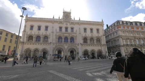Walking and driving in front of the Rossio train station Stock Footage 87263010
