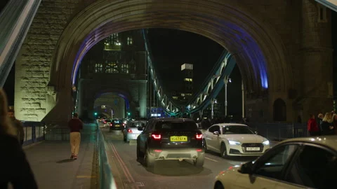 Walking and driving on Tower Bridge, at night Stock Footage 217067041