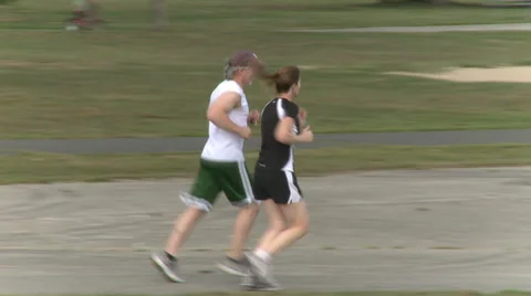 Walking and Jogging in the Park (2 of 7) Stock Footage 32326934