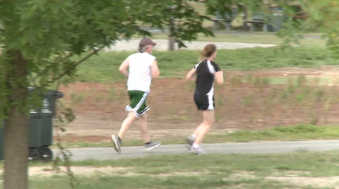Walking and Jogging in the Park (3 of 7) Stock Footage 32326935