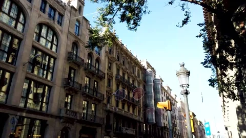 Walking and looking to the facade of the BCN Hotel Colonial Vidéo 244864356