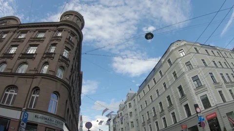 Walking and looking at Hanging Flags in a busy city street 4k60fps Stock Footage 136227788