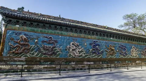 Walking and seeing the Nine Dragons Screen in Beihai Park, Beijing, China 스톡 동영상 64261294