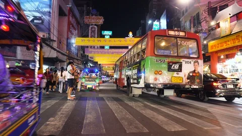 Walking and Weaving Through Traffic at Bustling Chinatown District of Bangkok Stock Footage 122148894