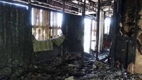 Walking around and inside burned and destroyed building light shining beautiful Stock Footage 78748091