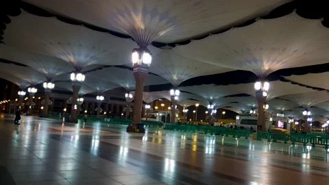 Walking around the courtyards of the Prophet's Mosque at night Stock Footage 232769111