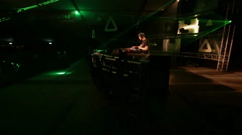 Walking around a DeeJay on a big stage Video stock 54998292