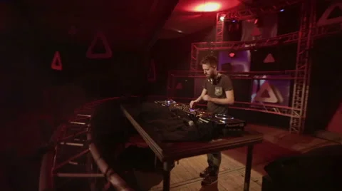 Walking around a DeeJay on a big stage Video stock 54998324