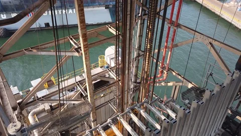 Walking around the derrick of the offshore drilling rig Stock Footage 123745756