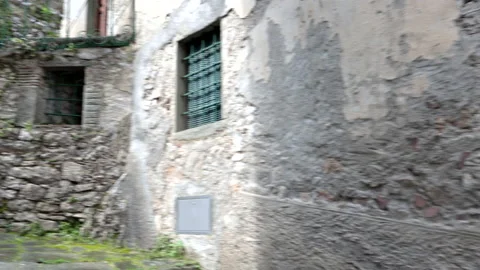 Walking around POV in the ghost town of Lucchio, Lucca, Italy. Video stock 238088363