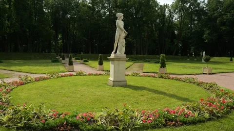 Walking around statue Young Mars in Lower Dutch Garden in Gatchina Palace Park Stock Footage 317781924