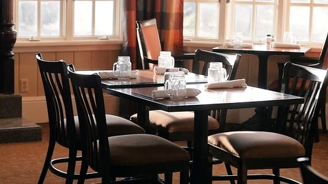 Walking around table in restaurant Stock Footage 102675656