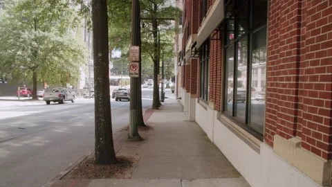 Walking Backwards Down Atlanta Sidewalk By Brick Building 4K 48FPS SLO-MO Stock Footage 270456157