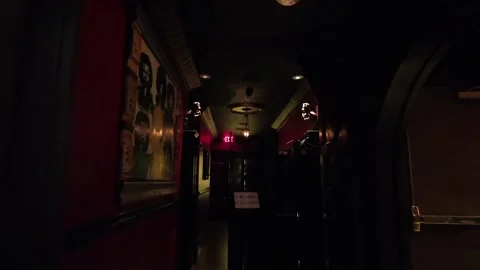 Walking Backwards Down Dark Corridor With Closed Exit Sign Stock Footage 318736687