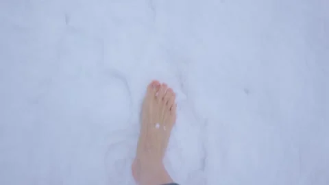 Walking Barefoot on Fresh, Soft Snow Brings a Unique Connection with Nature and Video stock 307449647