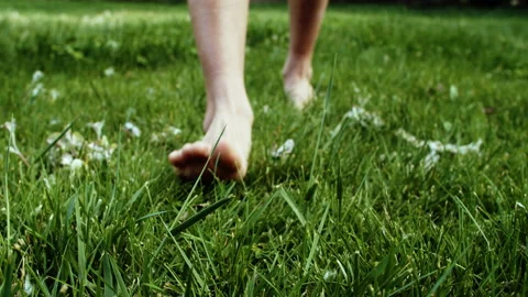 Walking barefoot on grass Stock Footage 161469274