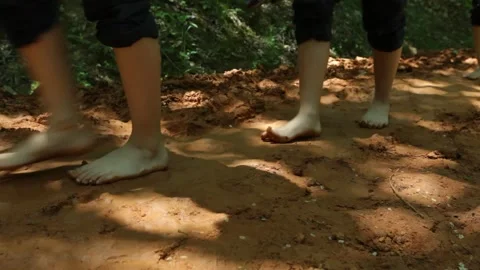 Walking barefoot on a road in the mountains Video stock 303551229