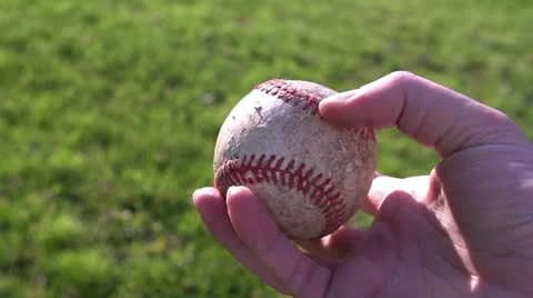 Walking with baseball in grass 库存影片 23488853