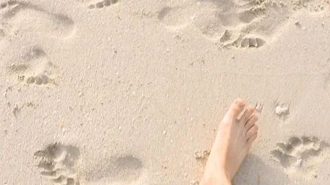 Walking on a beach close shot Stock Footage 99608694