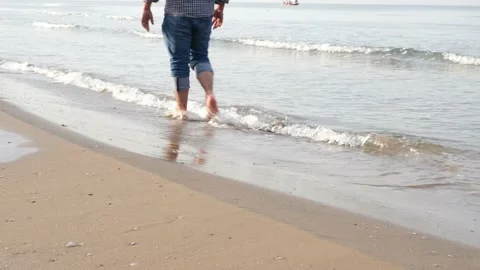 Walking on beach Stock Footage 168653681