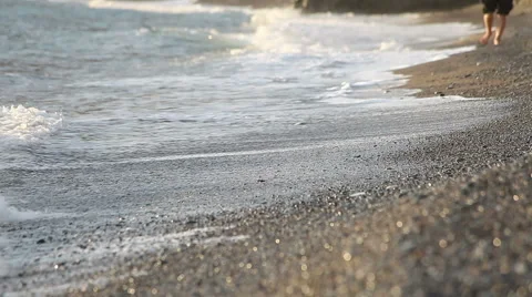 Walking on the beach with lapping waves Video stock 40470828