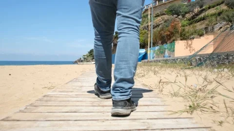 Walking on beach road Stock Footage 196764824