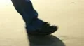 Walking on the beach, shoes close up HD Footage