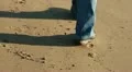 Walking on the beach, shoes close up HD Footage