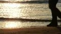 Walking on the beach, shoes close up HD Footage